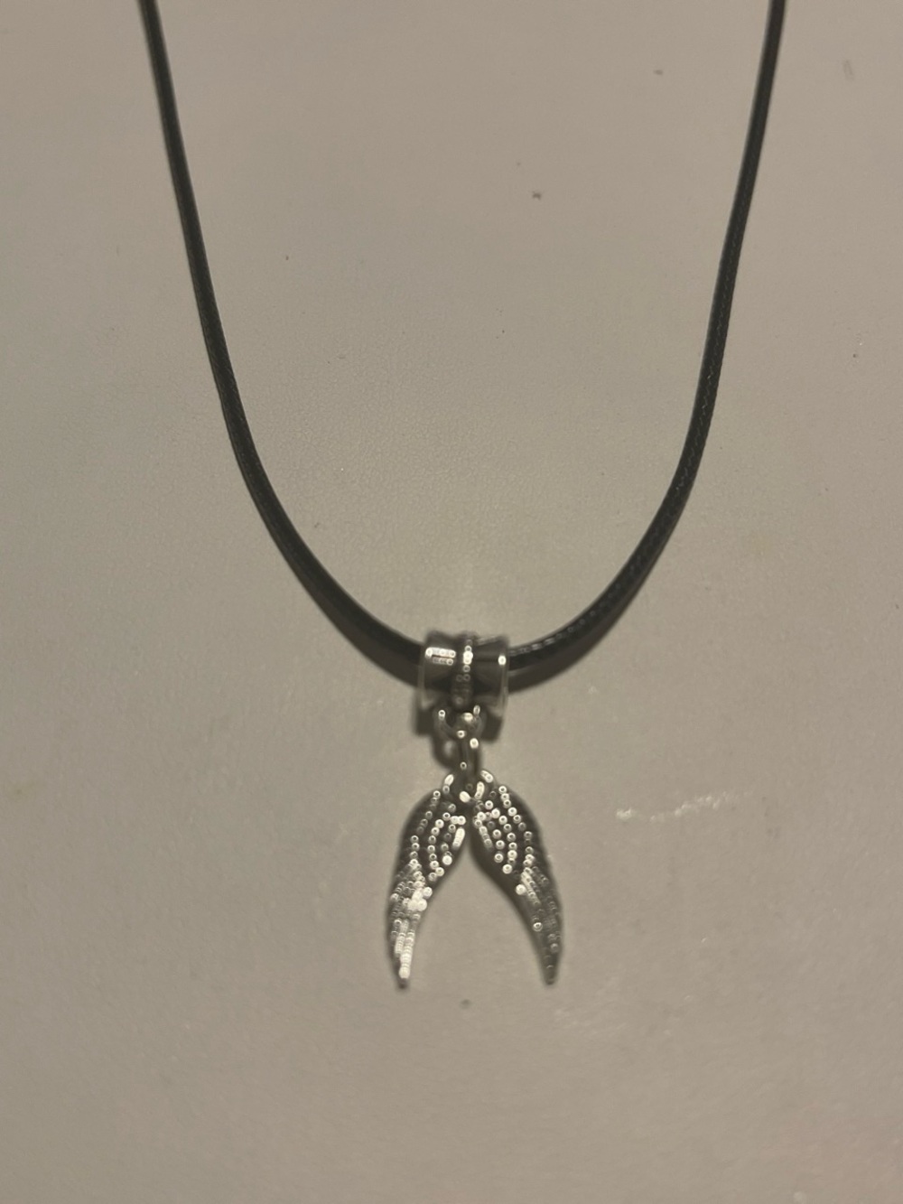 Angel wing necklace on 18 inch cord